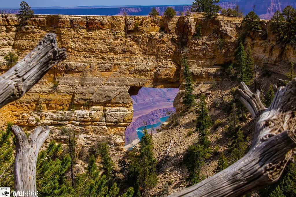 Unkar Delta is framed through the natural arch of Angels Window on the Cape Royal Trail