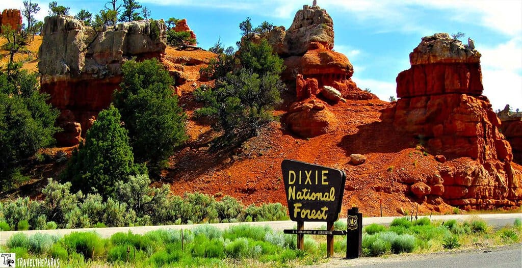 Red rock formations at Dixie National Forest with a sign in the foreground.

