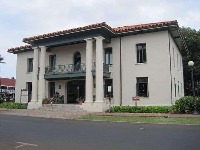Lahaina-Courthouse: A two-story beige building with white columns and red-tiled roof.