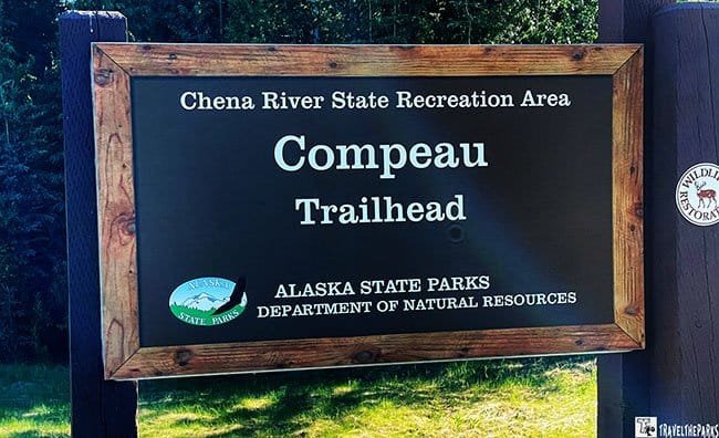 A wooden sign for Compeau Trailhead in Chena River State Recreation Area, Alaska.