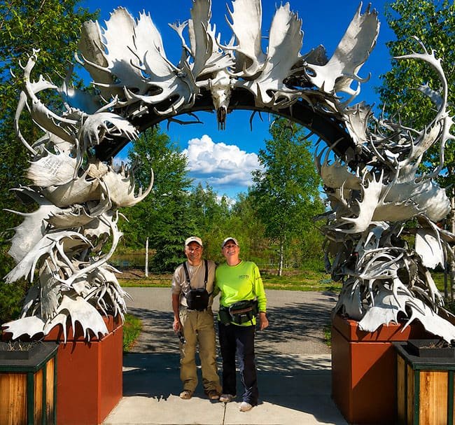 Antler Arch in Fairbanks with people standing under it