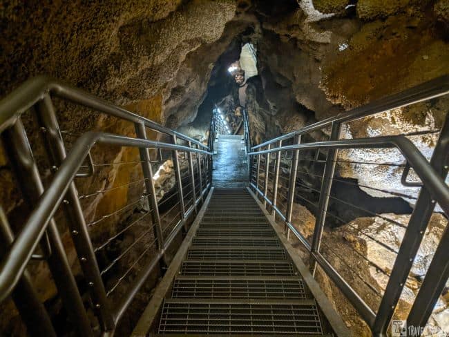 Metal staircase descending into a cave with rocky walls on an amazing Jewel Cave Scenic Tour.