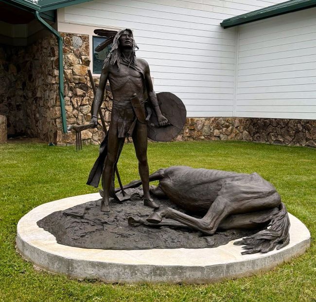 Bronze sculpture of Crazy Horse and his dying horse at the Welcome Center-Crazy Horse Memorial