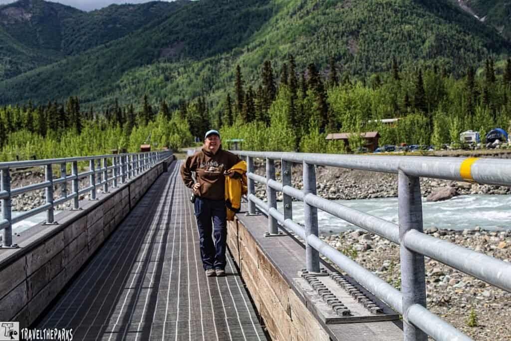 Kennicott River Footbridge End of the road with women standing on it