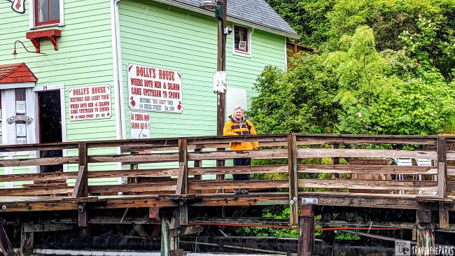 Women on the creek street boardwalk in front of the Dolly House