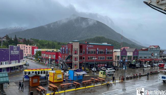 View of colorful town on a rainy day, featuring Ketchikan waterfront stores.