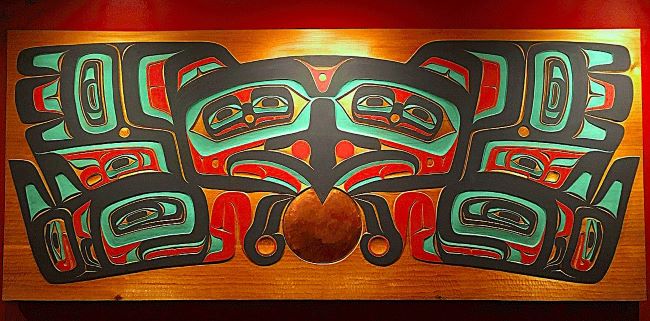 Raven Stealing the Sun-
This carved red cedar panel by Tlingit artists Nathan Jackson and Ernest Smeltzer represents the story of how Raven stole the sun and released it into the sky, bringing light to the world.