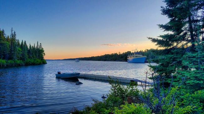 View of the rock harbor ranger III in the background as the sunsets