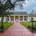 Front entrance of the Stephen Foster Museum a yellow colonial style building