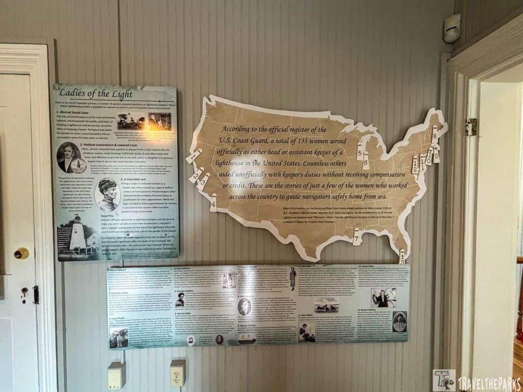 Display of educational panels about women lighthouse keepers, featuring a U.S. map and historical information.