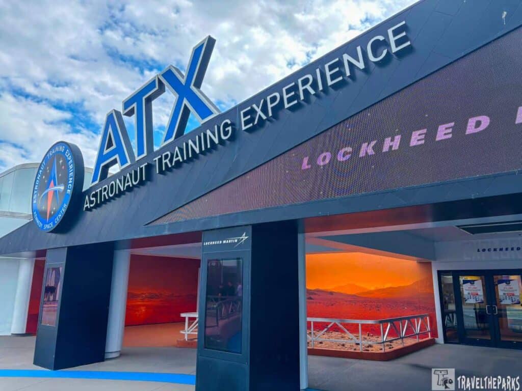 Entrance to the Astronaut Training Experience building with signage and digital display.