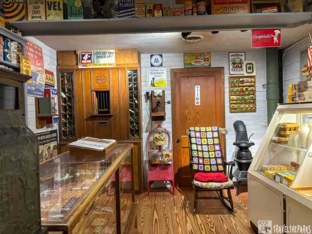 Vintage general store interior with retro items, wooden display cases, and vintage advertising signs.