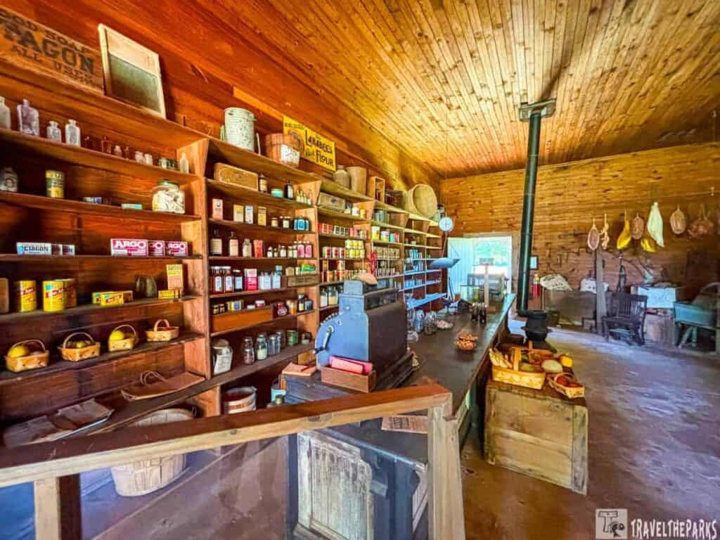 Interior of a rustic, old-fashioned Carter general store with wooden shelves and vintage goods.