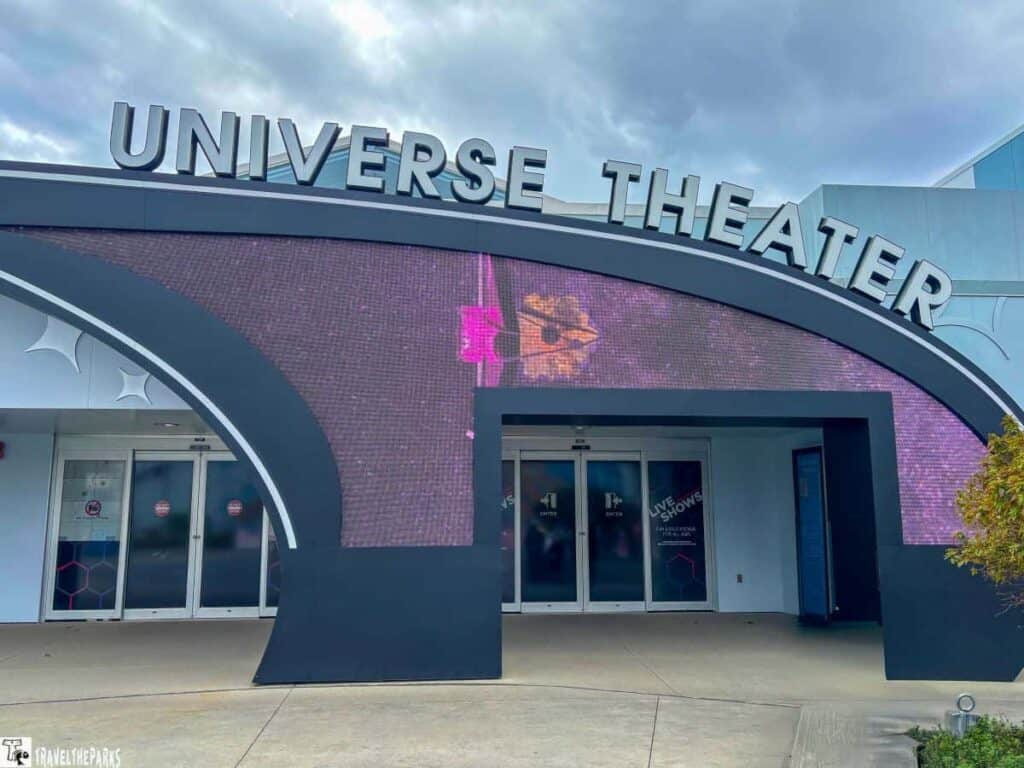 Entrance to the Universe Theater with large digital marquee and silver lettering.
