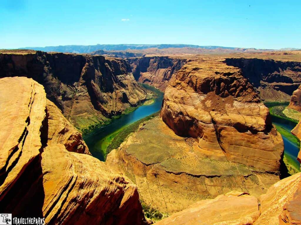 View of Horseshoe Bend with the Colorado River winding around a sandstone outcrop.