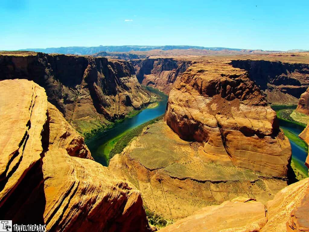 View of Horseshoe Bend with the Colorado River winding around a sandstone outcrop.
