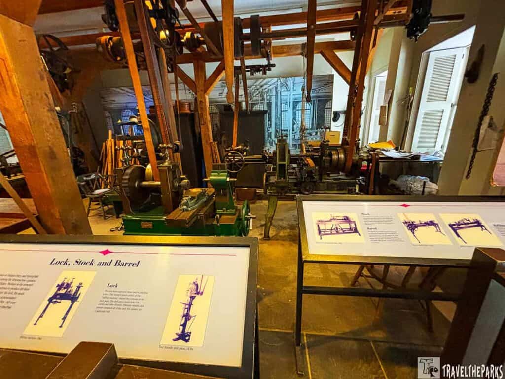 Interior of Harpers Ferry Building 4-Industry Museum with vintage machinery and informational panels.