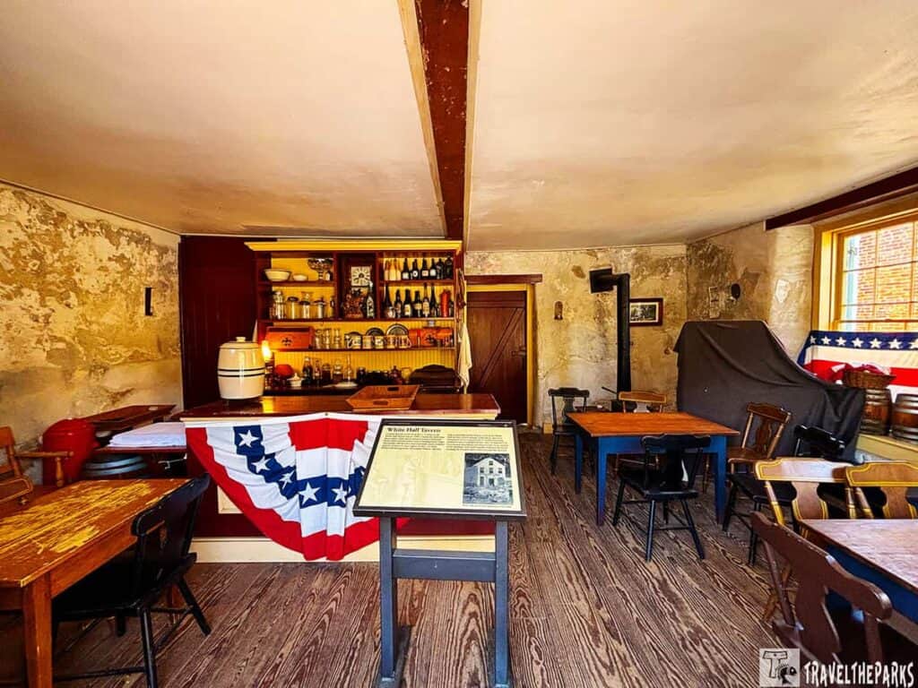 Interior of White Hall Tavern with wooden furnishings and rustic decor.