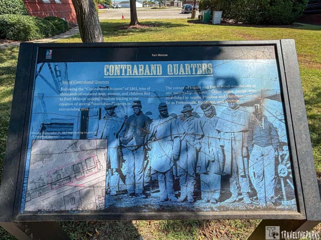 Informational sign about "Contraband Quarters" at Fort Monroe with a historical photo and map.

