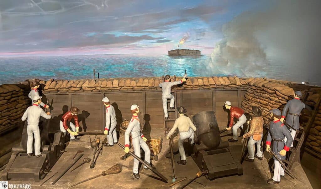 Diorama of soldiers in a trench during the Siege of Fort Sumter, with Fort Sumter visible in the background.