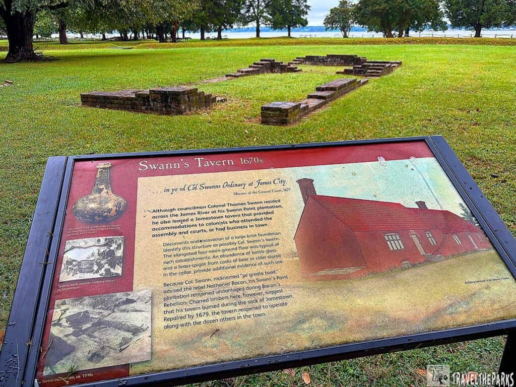 Swann's Tavern historical site with an informational sign and brick foundation remains.
