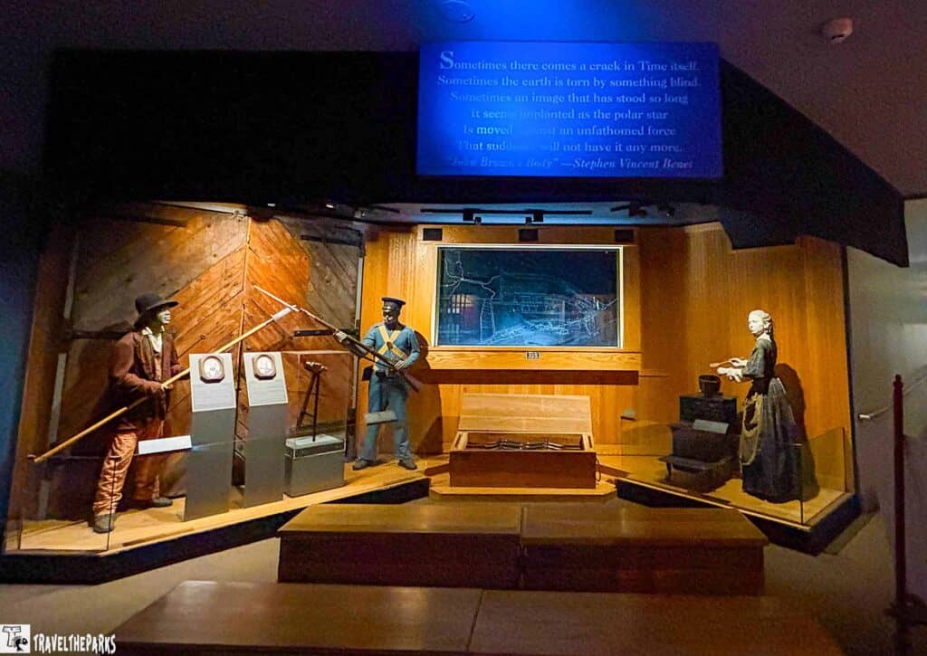 John Brown museum exhibit with historical figures in period attire, a map, and projected text.
