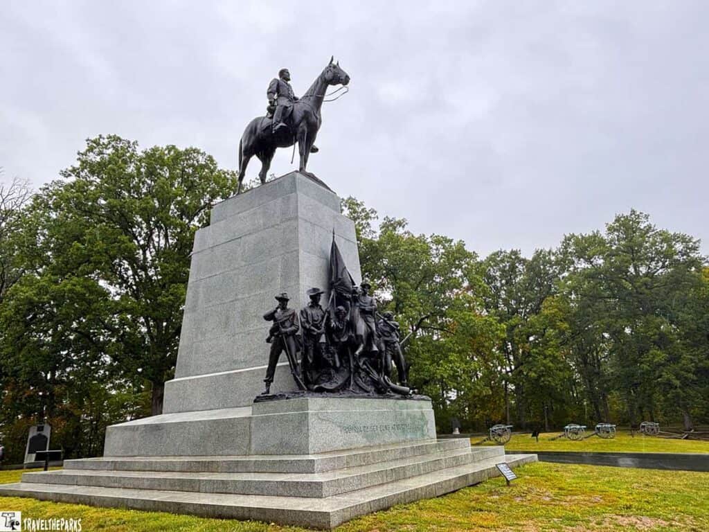 Virginia Memorial at Gettysburg showing an equestrian statue atop a granite pedestal, with soldier sculptures below.