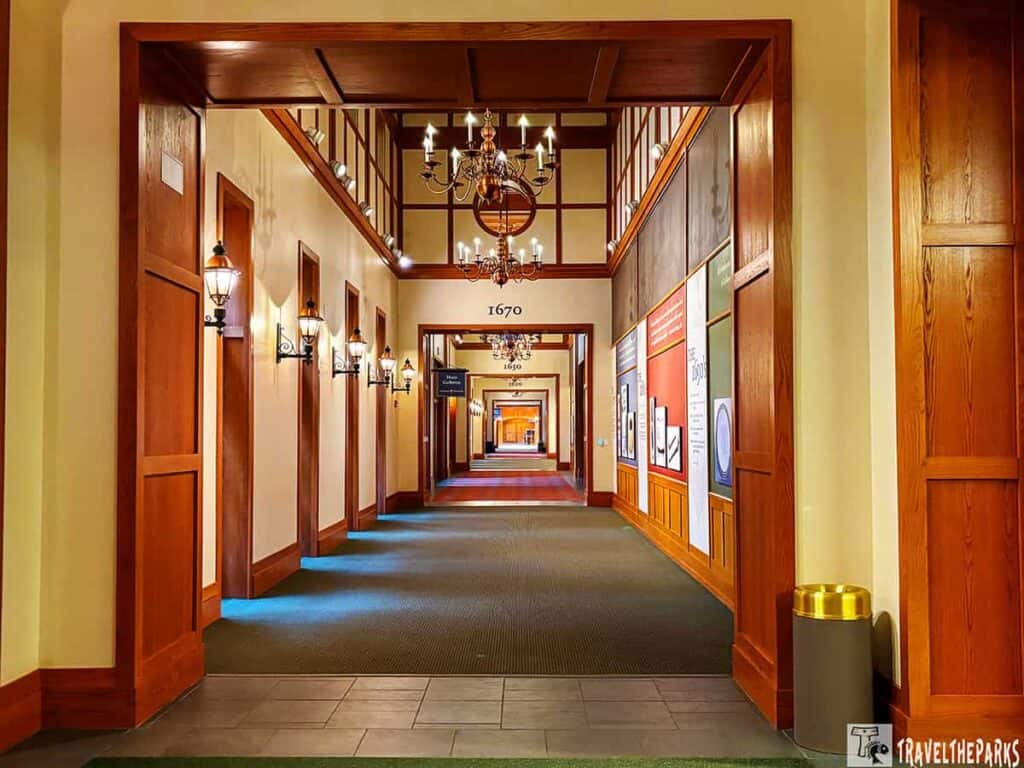 Elegant corridor with chandeliers and historical displays at Jamestown Settlement in Virginia's historical Triangle.