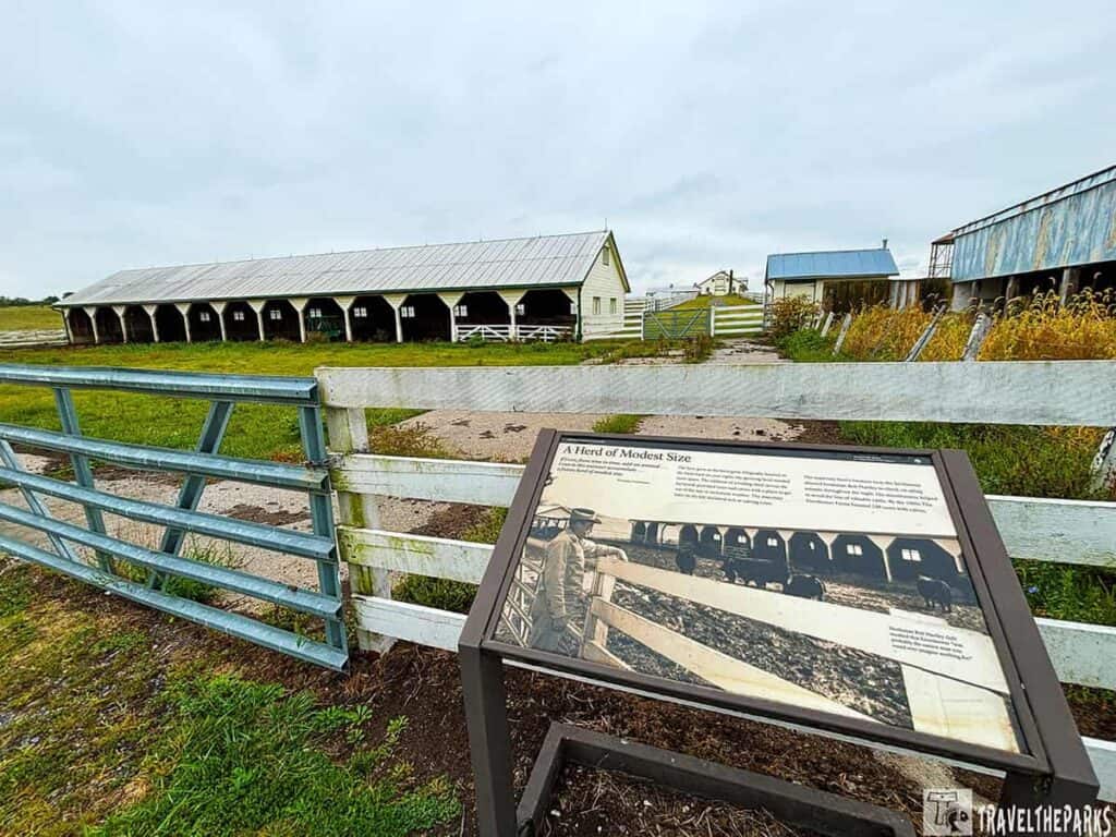 Farm scene with loafing shed and informational sign at Eisenhower National Historic Site.