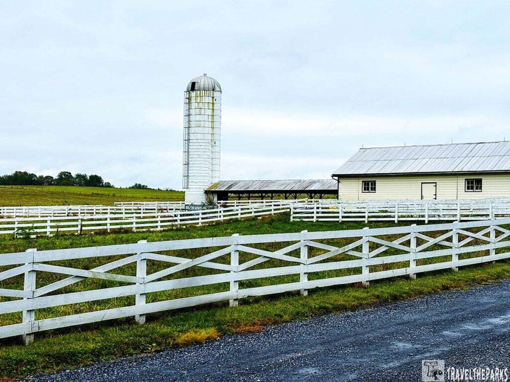 A farm scene with a white maternity barn and a silo at Eisenhower National Historic Site.