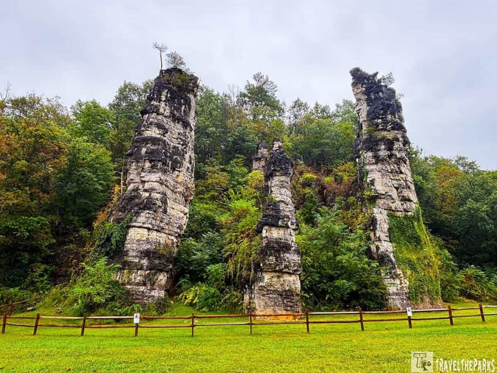 Three tall rock formations, the Natural Chimney's with greenery in Mt. Solon, Virginia.