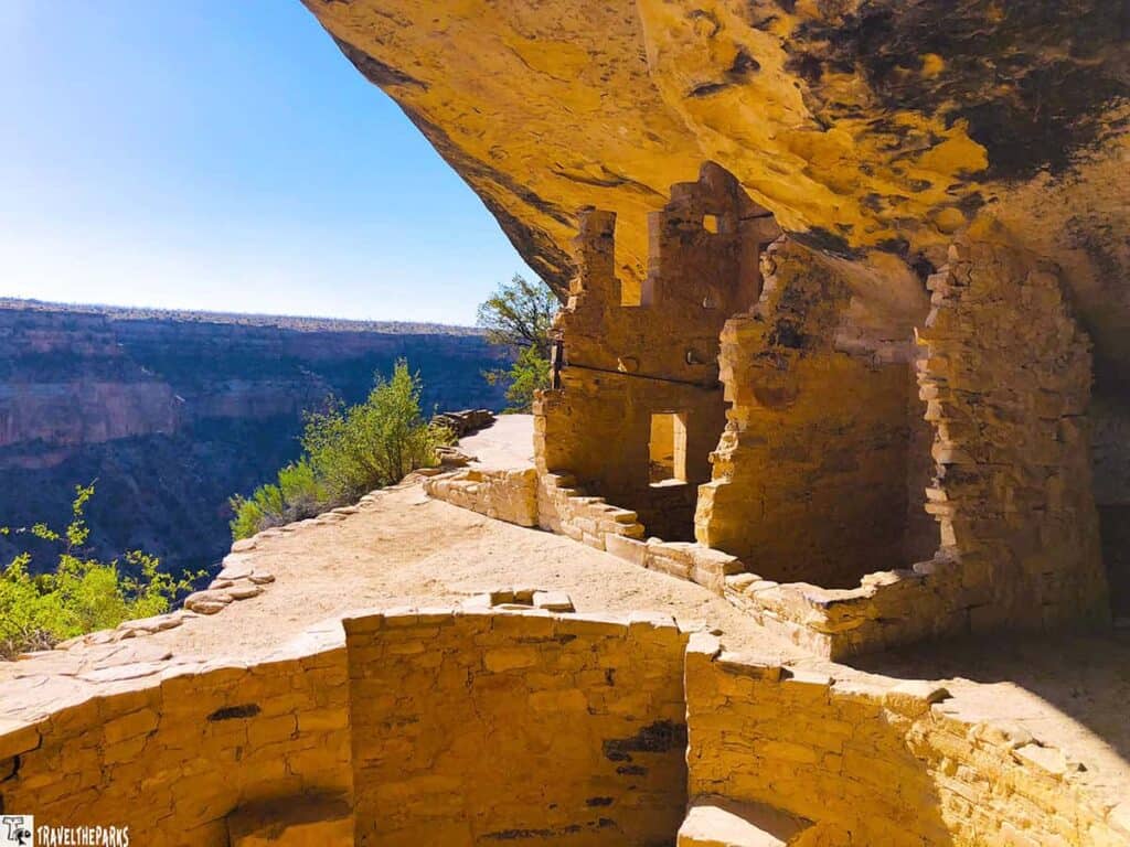 Ancient cliff dwellings at Balcony House, Mesa Verde, under a large sandstone overhang.