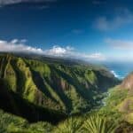 Epic Outdoor Adventures in Maui: Scenic overlook from Kauai mountains, featuring the lush, colorful valleys of Maui stretching out below.