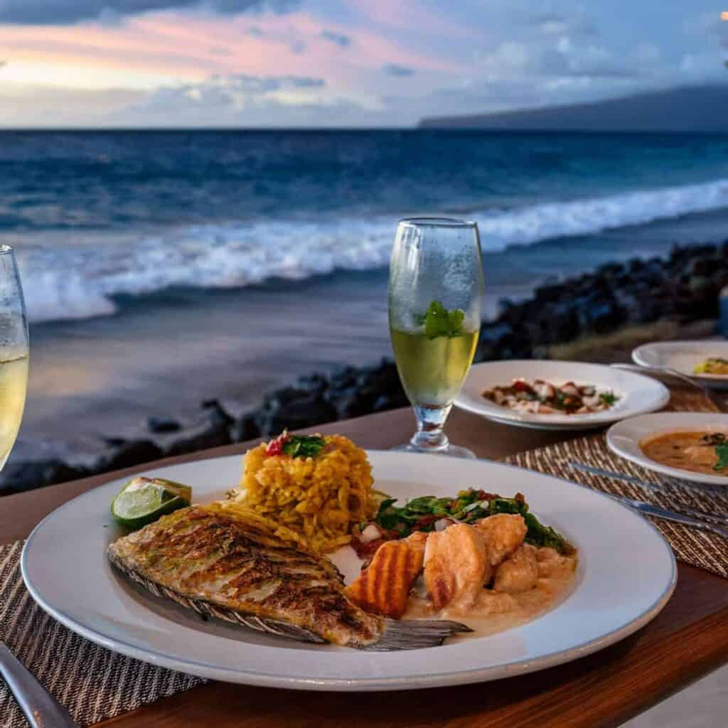 A dining table filled with an assortment of food and beverages, perfect for a festive meal or celebration.