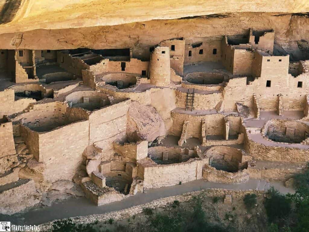 Cliff Palace with its stone structures, kivas, and towers set within a sandstone alcove.
