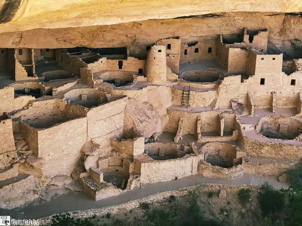 Cliff Palace with its stone structures, kivas, and towers set within a sandstone alcove.