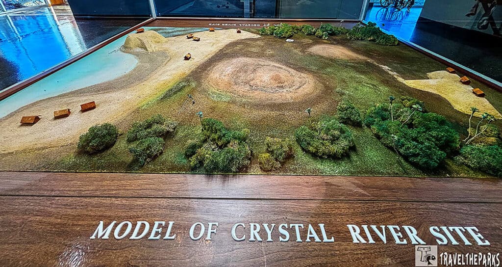Model of Crystal River Archaeological Site showing mounds, water bodies, vegetation, and small structures.

