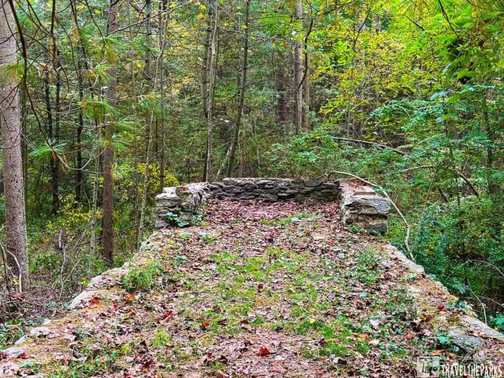 Marker Twenty-three. This area
is the site of the outdoor recreation and patio area of the
camp during all three eras of the camp’s history. The photo
shows the patio area behind the recreation building during
the POW era