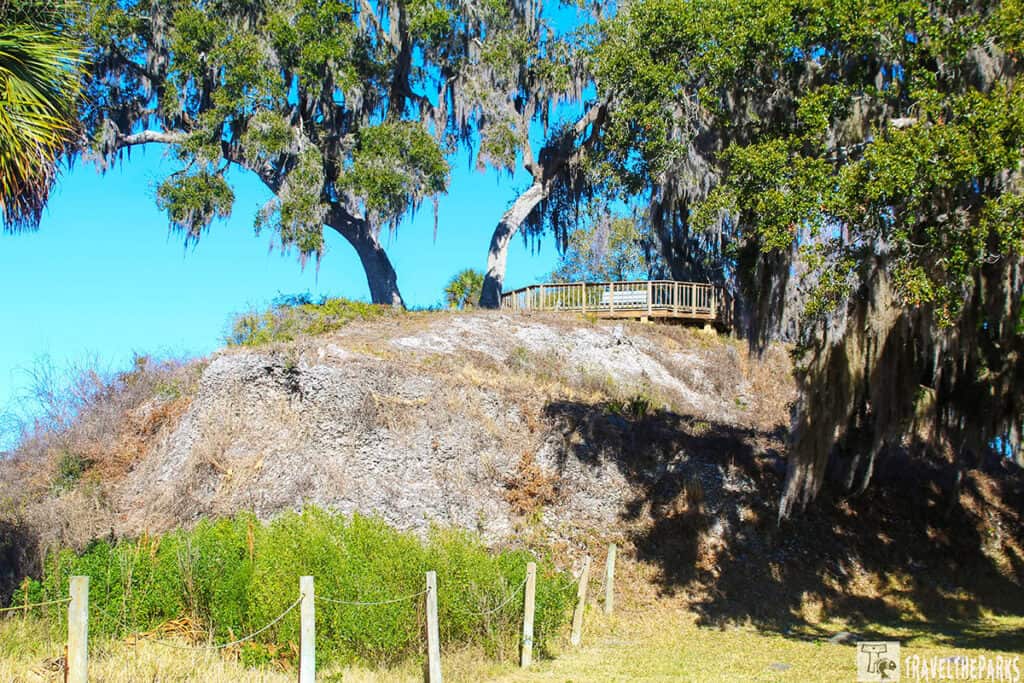 Temple Mound A at Crystal River Archaeological State Park with oak trees, Spanish moss, and an observation deck on top.

